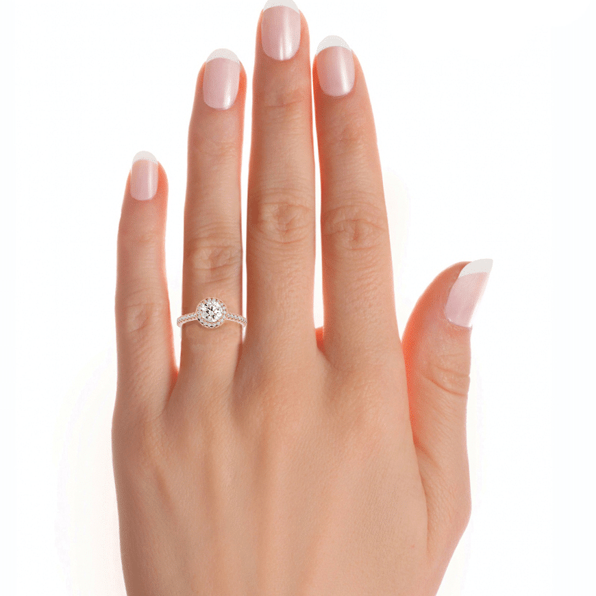 Stunning yellow gold pavé cathedral halo ring design.