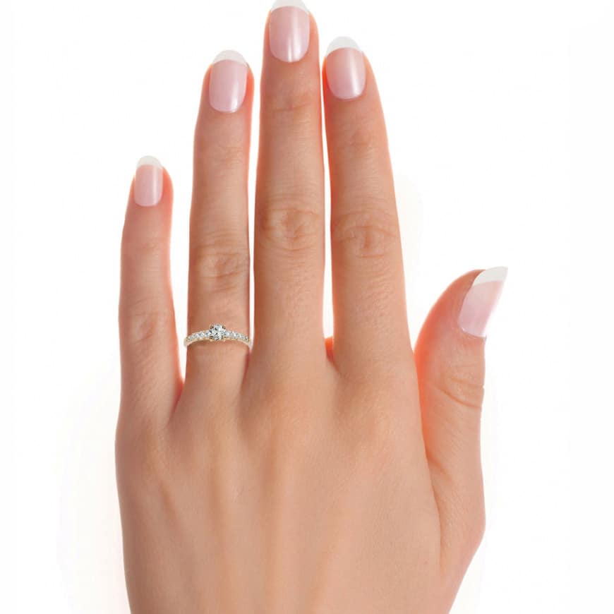 Stunning yellow gold hidden halo engagement ring with milgrain.