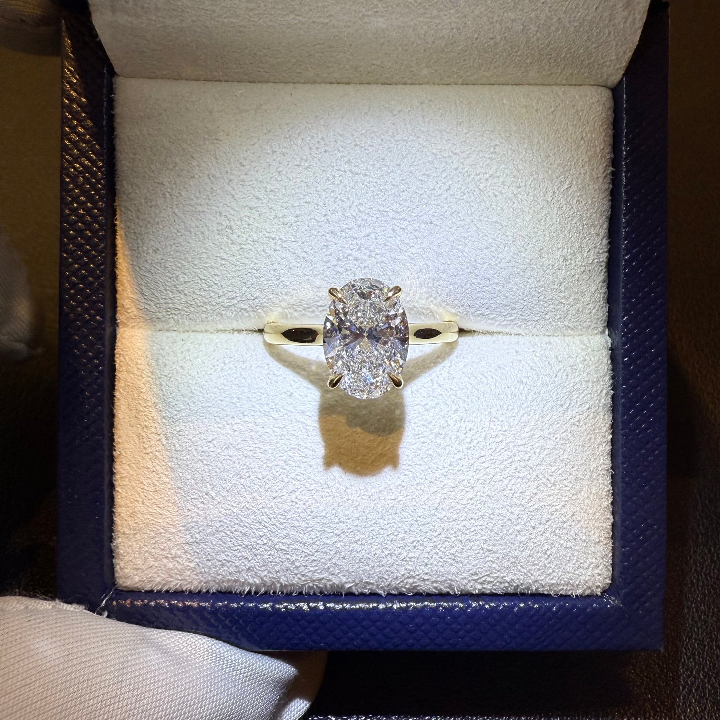 oval hidden halo engagement ring