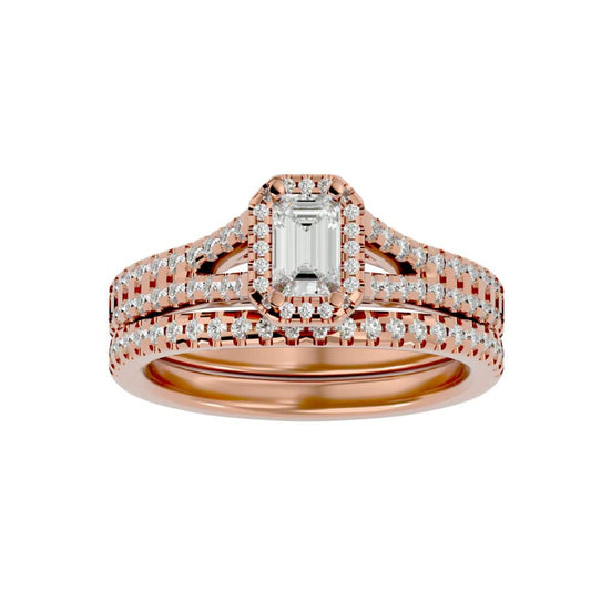 Romantic rose gold emerald halo engagement ring and wedding band.