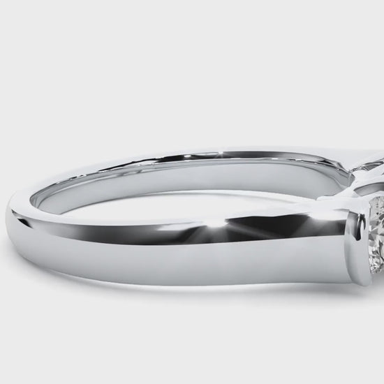 Three-stone engagement ring with bar-set diamonds in white gold