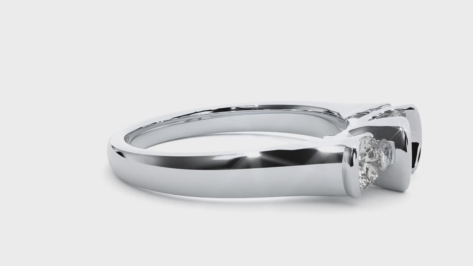 Three-stone engagement ring with bar-set diamonds in white gold