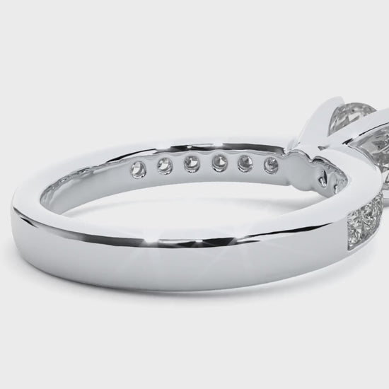 Classic solitaire diamond ring with secure 4-claw channel setting.