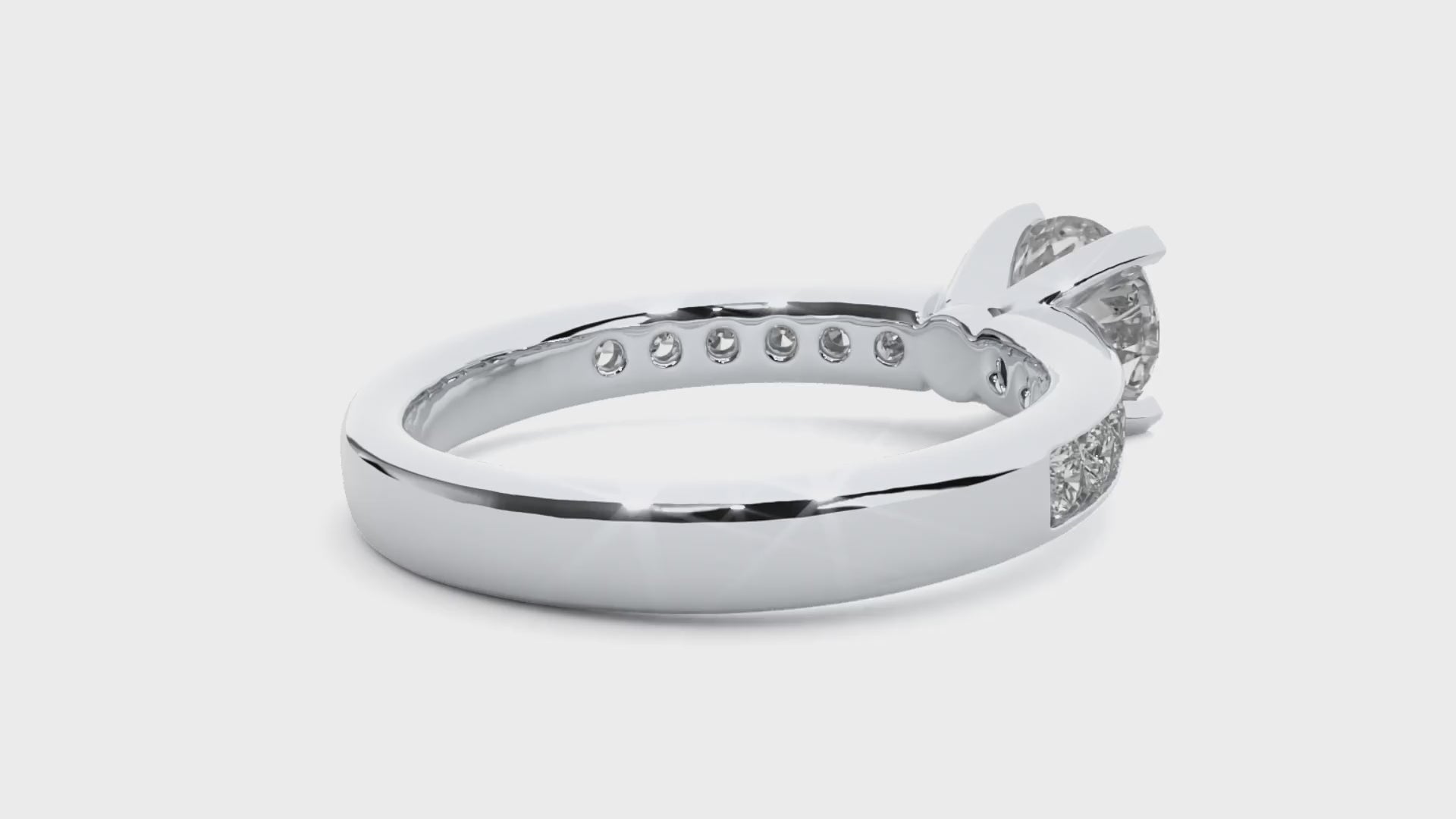 Classic solitaire diamond ring with secure 4-claw channel setting.