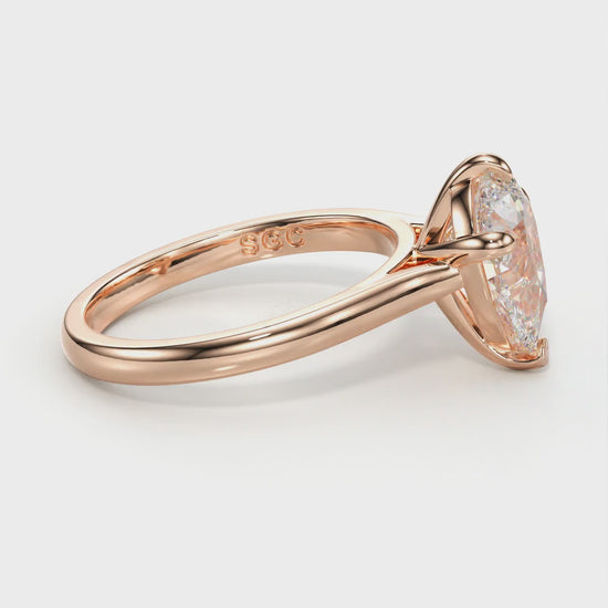 delicate pear engagement ring