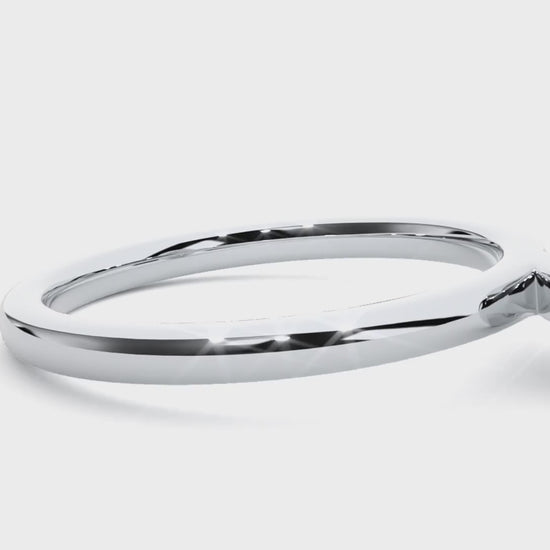 Platinum solitaire engagement ring with bezel-set diamond, modern and classic