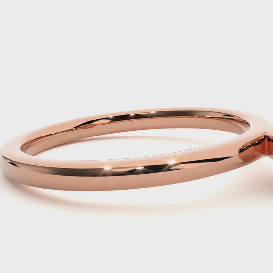 Bezel-set solitaire engagement ring in 18K gold with sleek, modern design