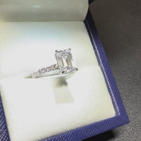 pave band emerald solitaire