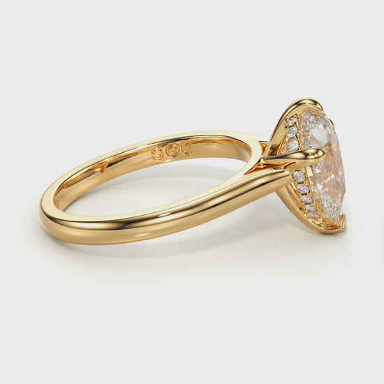 delicate pear engagement ring