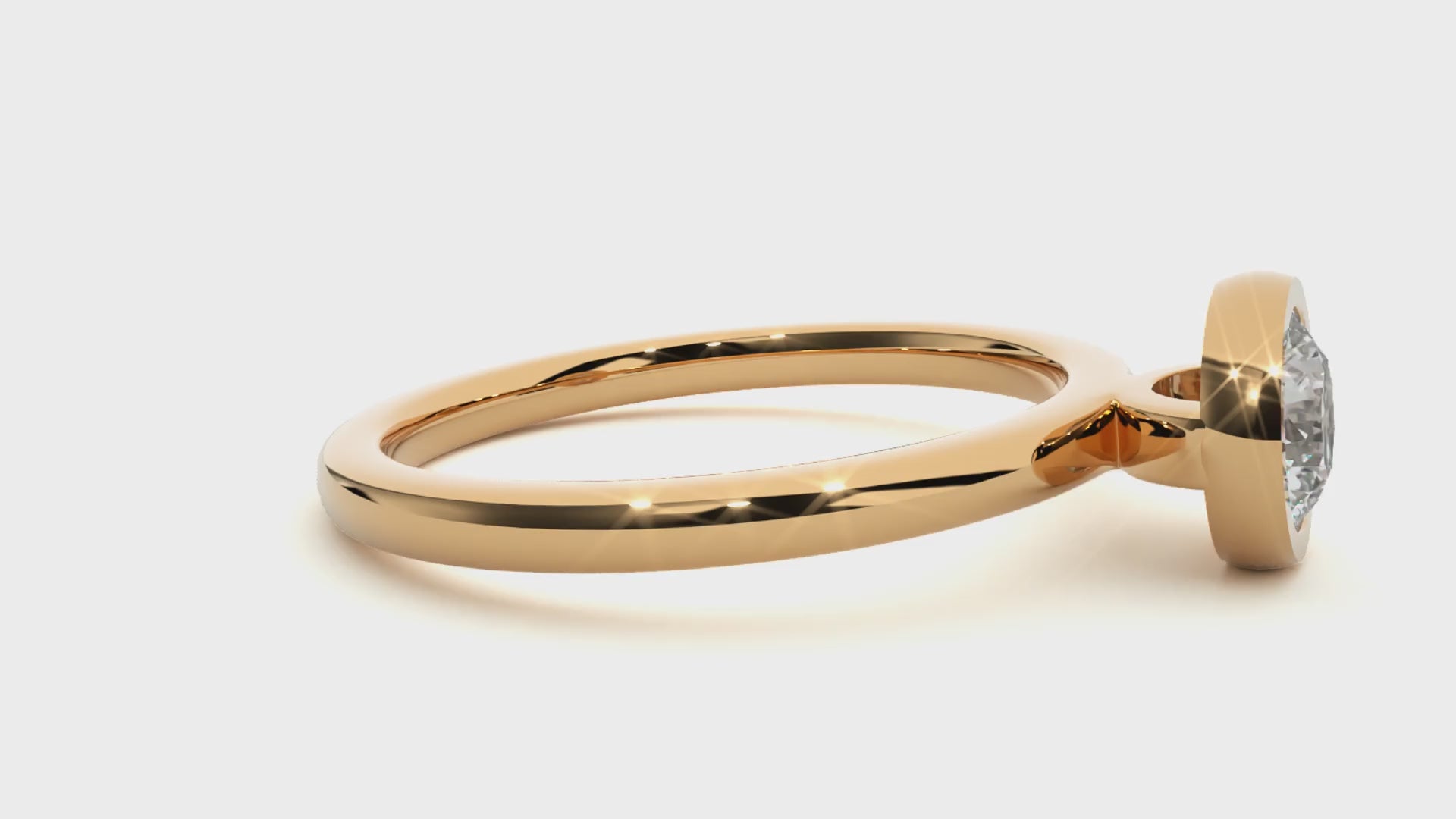 18K gold solitaire engagement ring featuring low-profile bezel setting