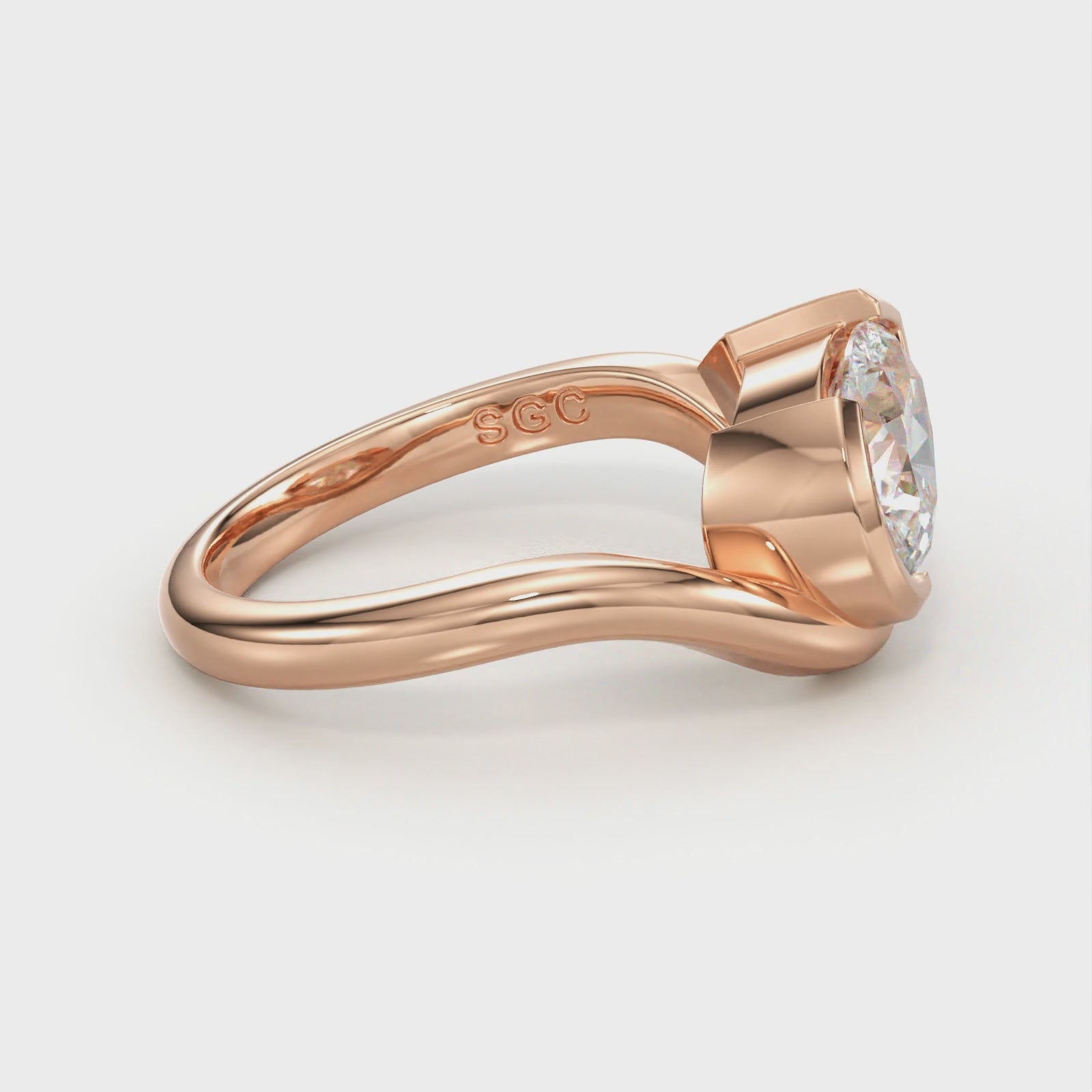 pear half bezel engagement ring