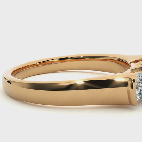 Three-stone engagement ring with bar-set diamonds in yellow gold