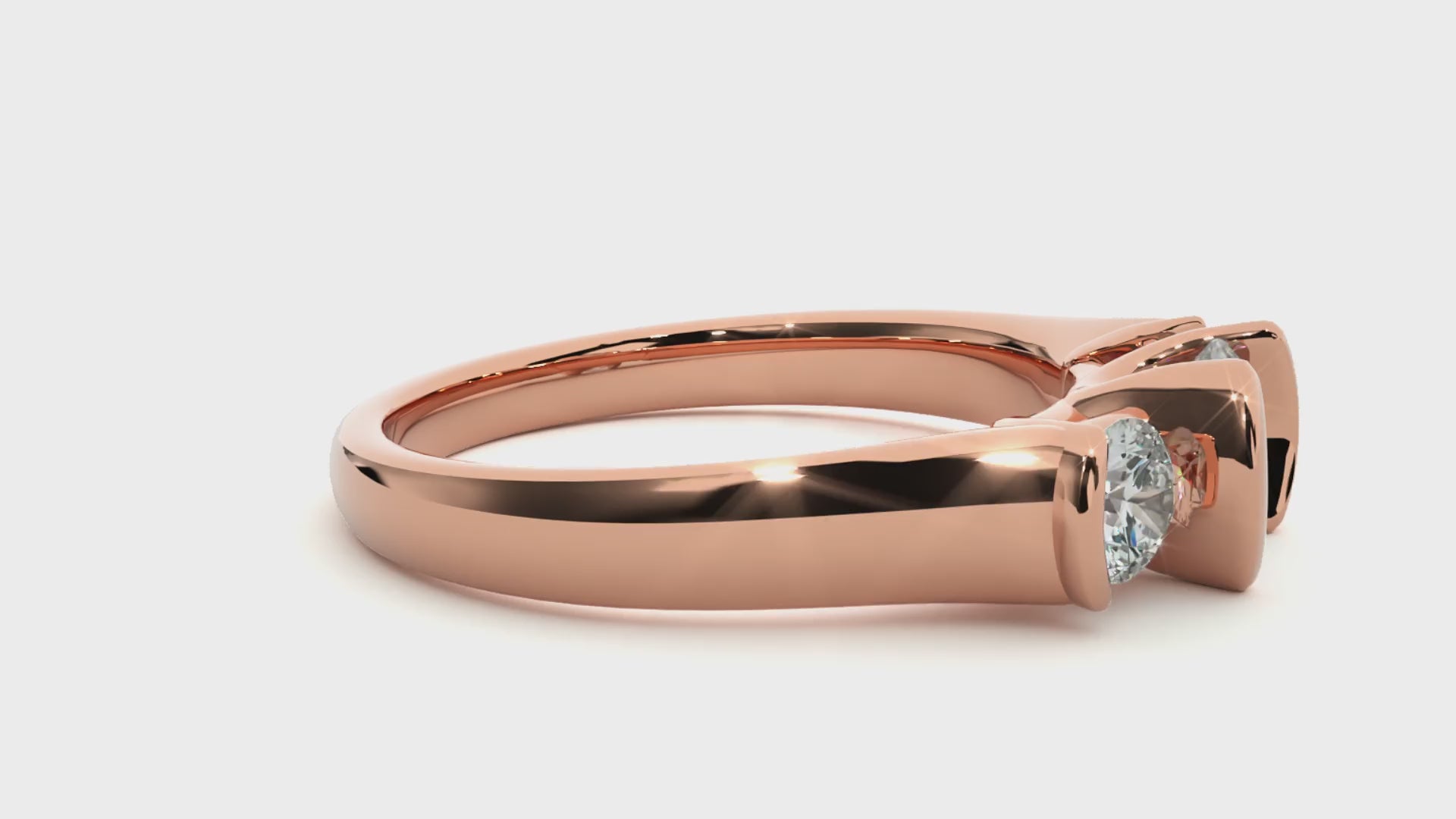 Three-stone engagement ring with bar-set diamonds in rose gold